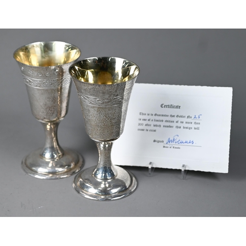 A pair of Lincoln Cathedral planished silver goblets with foliate engraving, limited edition nos. 24/25 of 200, John Cussell (Grantham), London Jubilee marks 1977, 12oz, 15cm high, c/w certificates, original suede drawstring bags and cardboard tubes