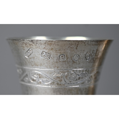 79 - A pair of Lincoln Cathedral planished silver goblets with foliate engraving, limited edition nos. 24... 