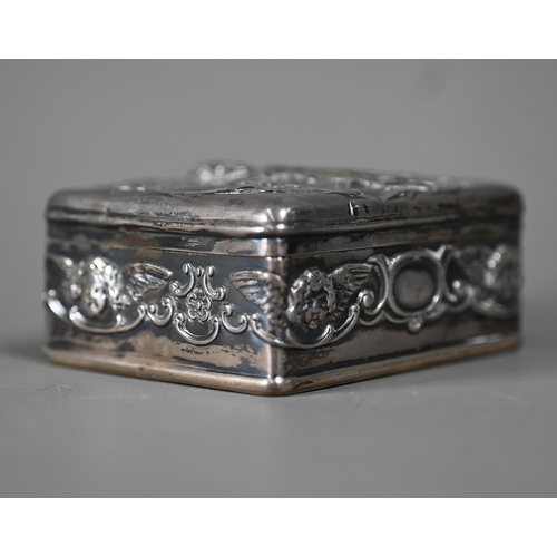 96 - An Edwardian silver trinket box and cover, embossed with cherubs, Goldsmiths and Silversmiths Co Ltd... 