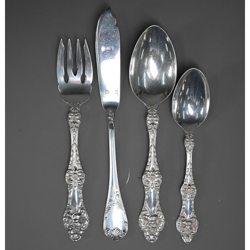 221 - A set of US Sterling Old Orange Blossom pattern flatware and cutlery for twelve settings, including ... 