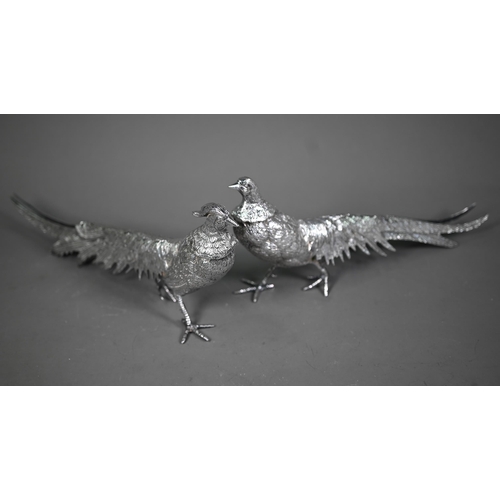 233 - Two silver-plated pheasant table-ornaments, 30 cm long