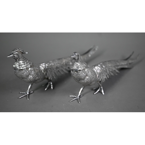 233 - Two silver-plated pheasant table-ornaments, 30 cm long