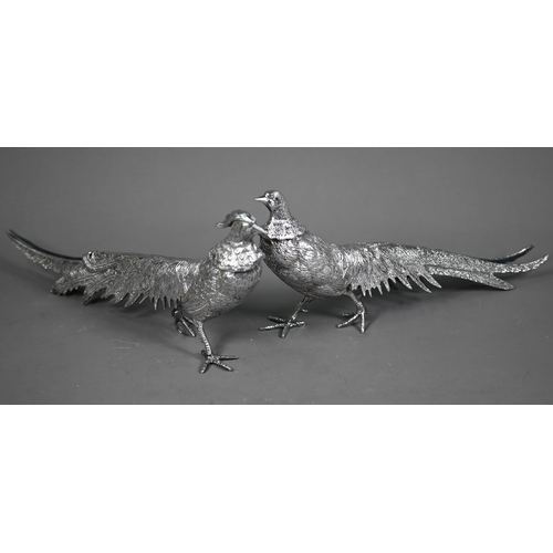 233 - Two silver-plated pheasant table-ornaments, 30 cm long