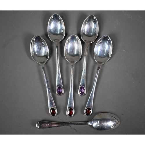 235 - An embossed silver five-piece brush set with hand-mirror, Birmingham 1985, to/w another hand-mirror,... 