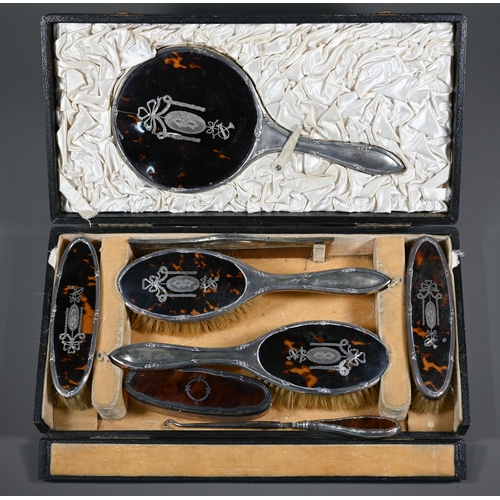 237 - A cased silver and tortoiseshell six piece brush set with pique-work decoration, London 1915, to/w a... 