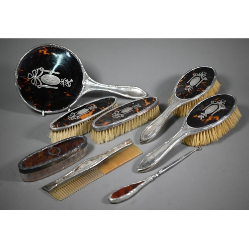 237 - A cased silver and tortoiseshell six piece brush set with pique-work decoration, London 1915, to/w a... 