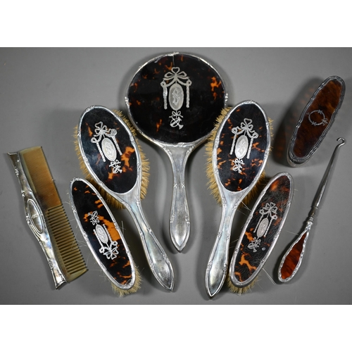 237 - A cased silver and tortoiseshell six piece brush set with pique-work decoration, London 1915, to/w a... 