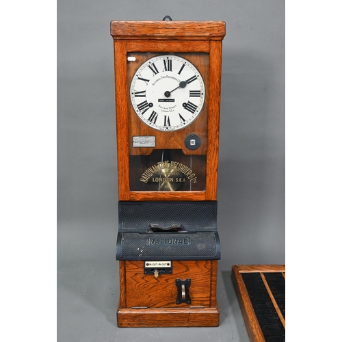 1011 - The National Time Recording Co. Ltd, a vintage oak cased time clock, with card slots and key, 98 cm ... 