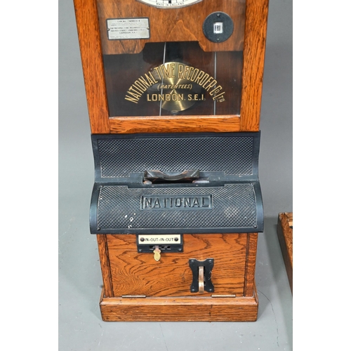 1011 - The National Time Recording Co. Ltd, a vintage oak cased time clock, with card slots and key, 98 cm ... 