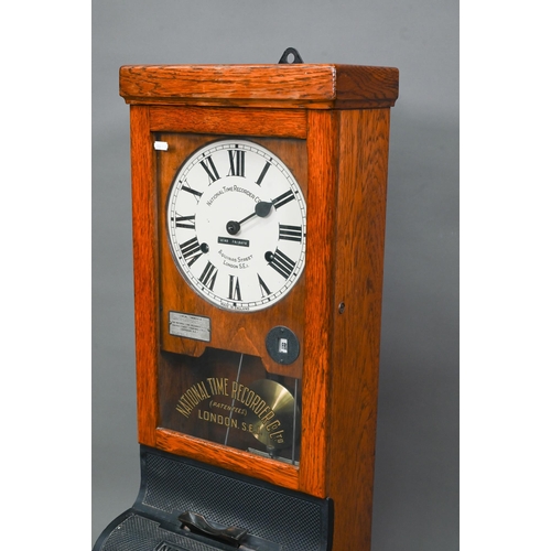 1011 - The National Time Recording Co. Ltd, a vintage oak cased time clock, with card slots and key, 98 cm ... 