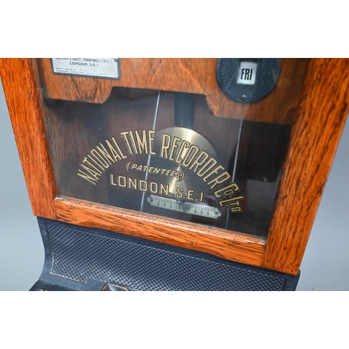 1011 - The National Time Recording Co. Ltd, a vintage oak cased time clock, with card slots and key, 98 cm ... 