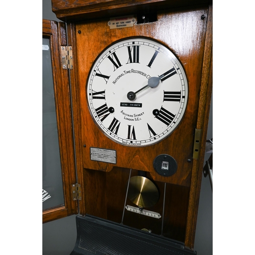 1011 - The National Time Recording Co. Ltd, a vintage oak cased time clock, with card slots and key, 98 cm ... 