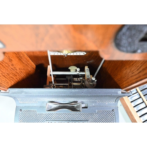 1011 - The National Time Recording Co. Ltd, a vintage oak cased time clock, with card slots and key, 98 cm ... 