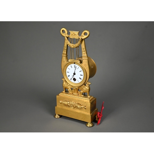 1012 - An antique Egyptian Revival ormolu mantel clock, the 8-day drum movement stamped CV 44, with (damage... 