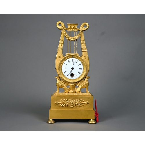 1012 - An antique Egyptian Revival ormolu mantel clock, the 8-day drum movement stamped CV 44, with (damage... 