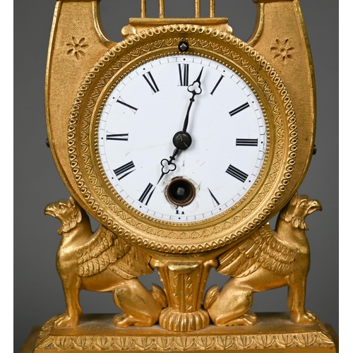 1012 - An antique Egyptian Revival ormolu mantel clock, the 8-day drum movement stamped CV 44, with (damage... 