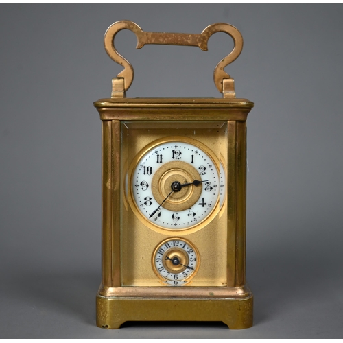 1017 - A miniature brass cased carriage alarm clock, 9 cm h