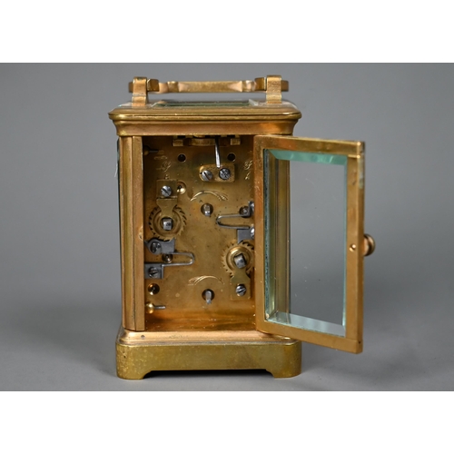 1017 - A miniature brass cased carriage alarm clock, 9 cm h