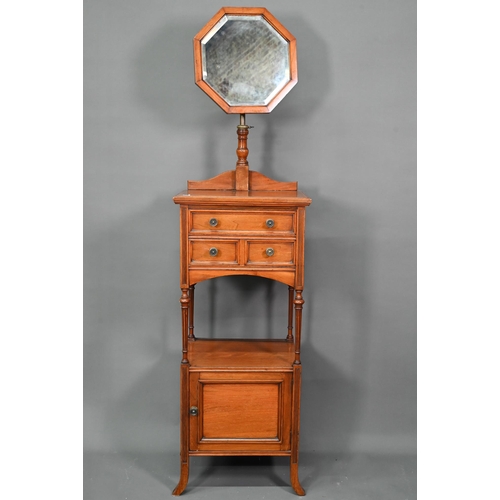 1020 - A circa 1900 dressing stand with octagonal framed adjustable mirror over three drawers and open shel... 