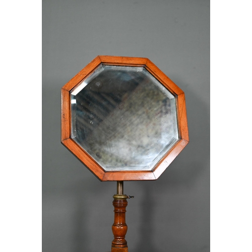 1020 - A circa 1900 dressing stand with octagonal framed adjustable mirror over three drawers and open shel... 