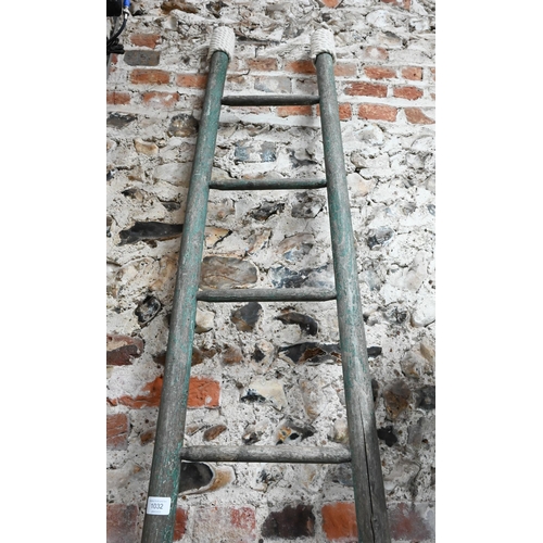 1032 - A vintage distress paint finished ladder, 262 cm long x 36 cm w