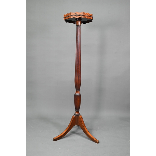 1033 - A Sheraton inlaid satinwood and mahogany torchere, the octagonal top with wavy edged gallery raised ... 