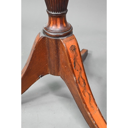 1033 - A Sheraton inlaid satinwood and mahogany torchere, the octagonal top with wavy edged gallery raised ... 