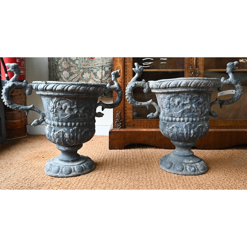 1034 - A pair of antique classical style lead urns, with dragon handles, 56 cm h (2)