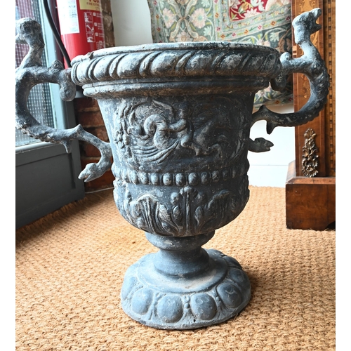 1034 - A pair of antique classical style lead urns, with dragon handles, 56 cm h (2)