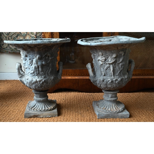 1035 - A pair of antique campana style lead urns, with loop handles, 56 cm h (2)