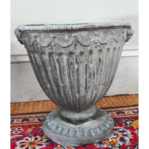 1036 - An antique pair of Adam style lead urns, 37 cm h (2)