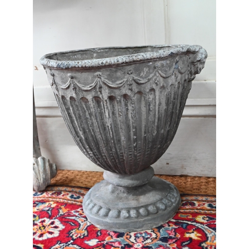 1036 - An antique pair of Adam style lead urns, 37 cm h (2)