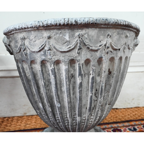 1036 - An antique pair of Adam style lead urns, 37 cm h (2)