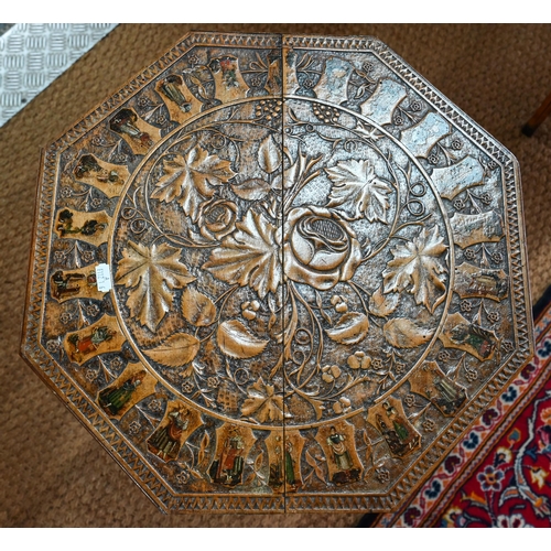 1044 - A Continental walnut tripod table, the octagonal top with costume figures to the circumference, 42 c... 