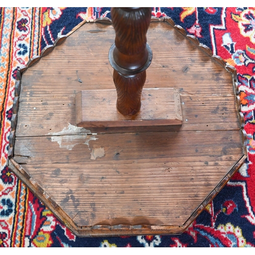 1044 - A Continental walnut tripod table, the octagonal top with costume figures to the circumference, 42 c... 