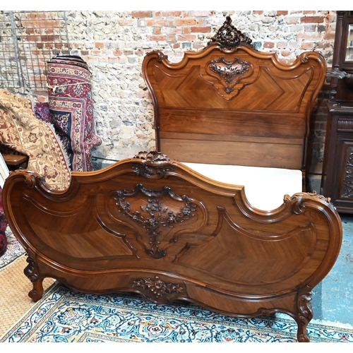 1045 - An antique French kingwood bedstead, with mattress + base (marks to mattress) 200 cm x 172 cm, the h... 