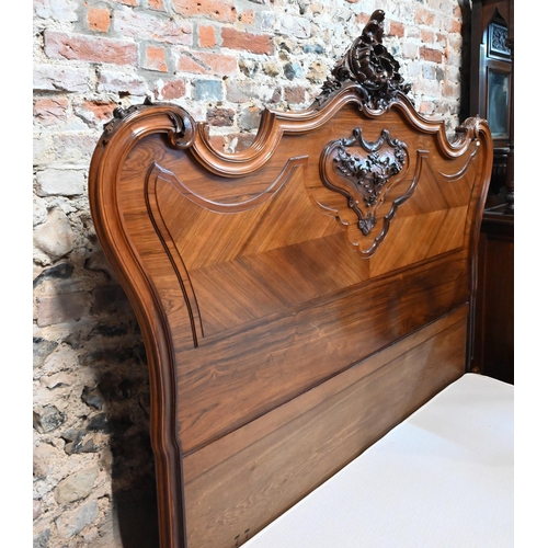 1045 - An antique French kingwood bedstead, with mattress + base (marks to mattress) 200 cm x 172 cm, the h... 