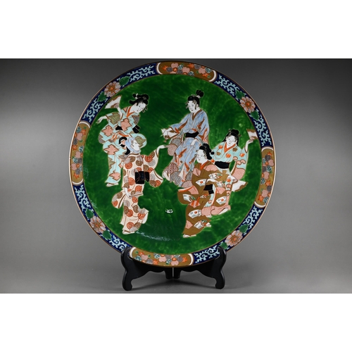 518 - A large late 19th century Japanese porcelain charger, Meiji period (1868-1912) painted in bright pol... 