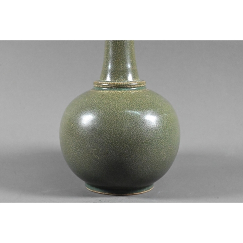 531 - A Chinese globular vase with flared neck and everted foliate rim, covered overall with an opaque cra... 