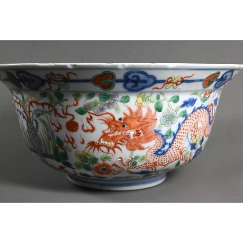 561 - A late 19th or early 20th century (Kangxi Revival) Chinese wucai 'dragon and phoenix' bowl, painted ... 