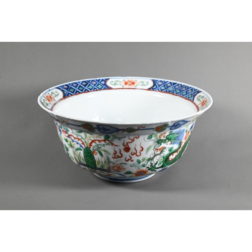 561 - A late 19th or early 20th century (Kangxi Revival) Chinese wucai 'dragon and phoenix' bowl, painted ... 