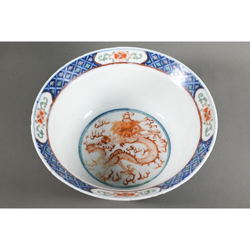 561 - A late 19th or early 20th century (Kangxi Revival) Chinese wucai 'dragon and phoenix' bowl, painted ... 