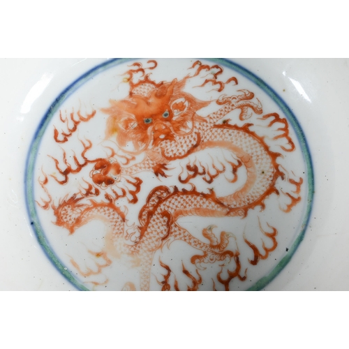 561 - A late 19th or early 20th century (Kangxi Revival) Chinese wucai 'dragon and phoenix' bowl, painted ... 