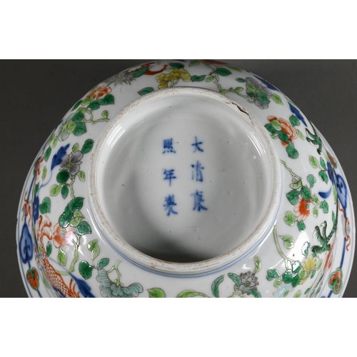 561 - A late 19th or early 20th century (Kangxi Revival) Chinese wucai 'dragon and phoenix' bowl, painted ... 