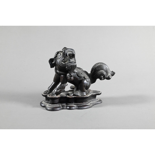 571 - A 19th century Chinese bronze figure of a Buddhistic guardian lion, possibly an incense stand, Qing ... 