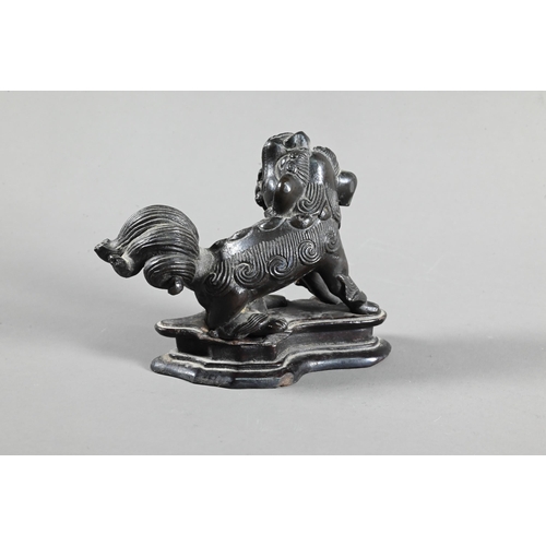 571 - A 19th century Chinese bronze figure of a Buddhistic guardian lion, possibly an incense stand, Qing ... 