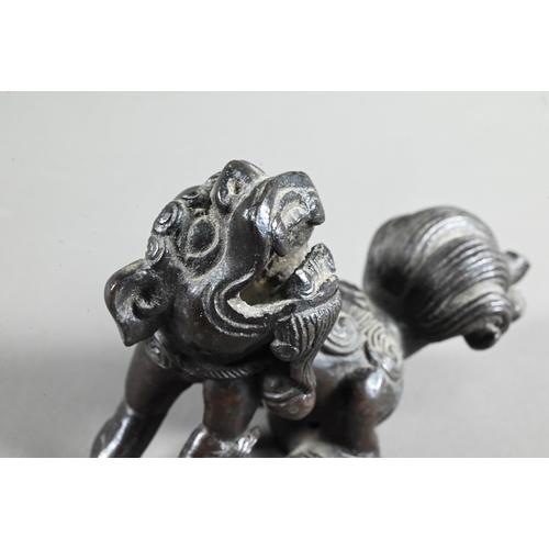 571 - A 19th century Chinese bronze figure of a Buddhistic guardian lion, possibly an incense stand, Qing ... 