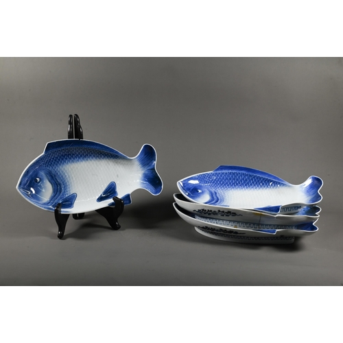 572 - Four 19th century Japanese Arita blue and white pocelain fish shaped kaiseki plates, Meiji period (1... 