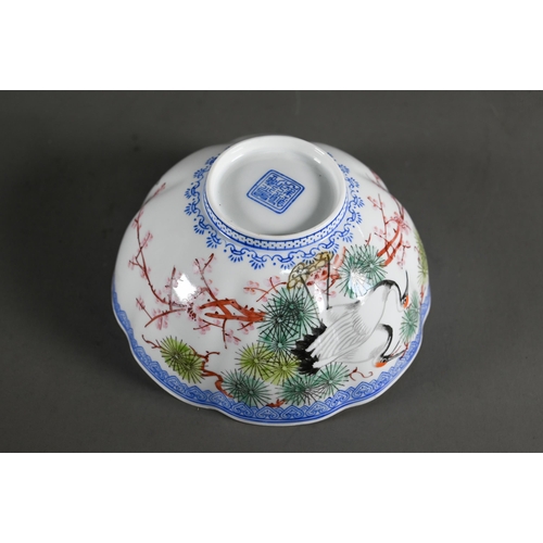 574 - A 20th century Chinese egg-shell porcelain floriform bowl, painted with red-crowned cranes and pine ... 