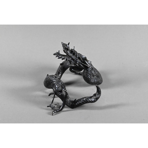 579 - A Chinese bronze three-clawed Mizuchi Dragon, modelled with long scaly, sinuous body and fierce expr... 